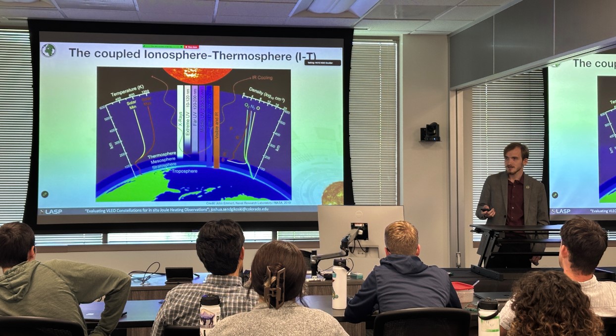 Joshua presenting his research on ionosphere-thermosphere processes and simulated satellite observations